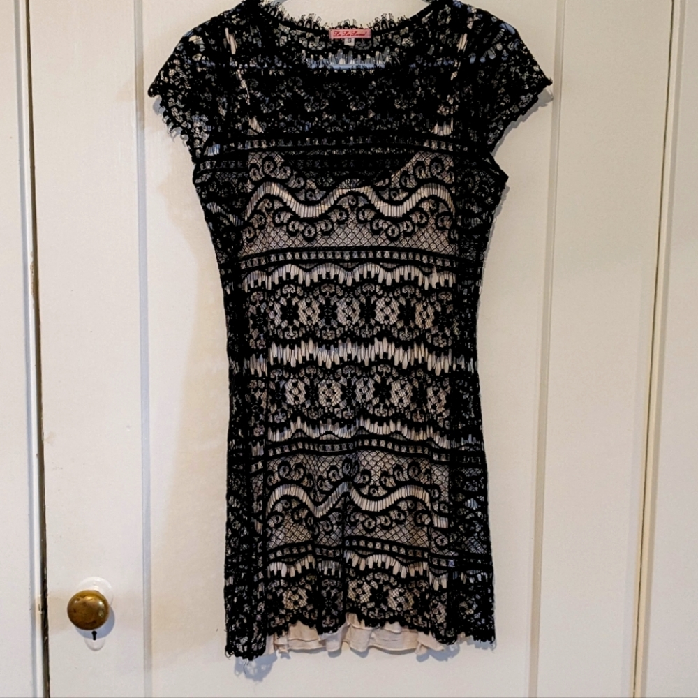Small mini dress. Black lace exterior, soft, poly interior. LaLaLamé